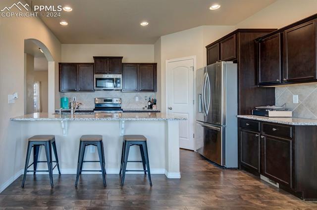 11353 Avena Road Peyton, CO 80831 - Photo 13 of 46 Kitchen featuring coffee bar area