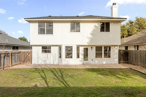 a front view of a house with a swimming pool