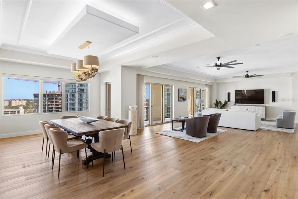 1111 Ritz Carlton Drive, Unit 1803 Sarasota, FL 34236 - Photo 18 of 65 a view of a dining room with furniture and wooden floor