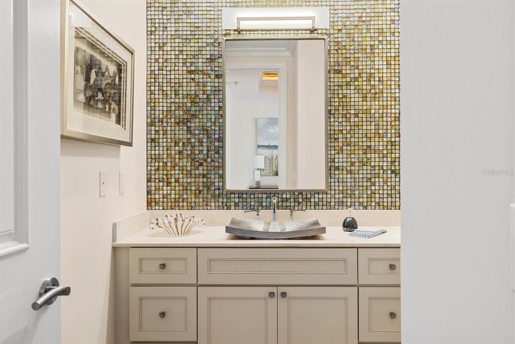 1111 Ritz Carlton Drive, Unit 1803 Sarasota, FL 34236 - Photo 25 of 65 a bathroom with a sink and a mirror