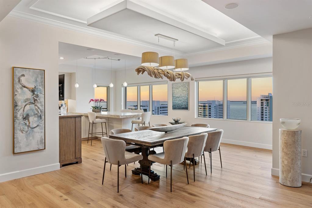 1111 Ritz Carlton Drive, Unit 1803 Sarasota, FL 34236 - Photo 47 of 65 a view of a dining room with furniture and a large window