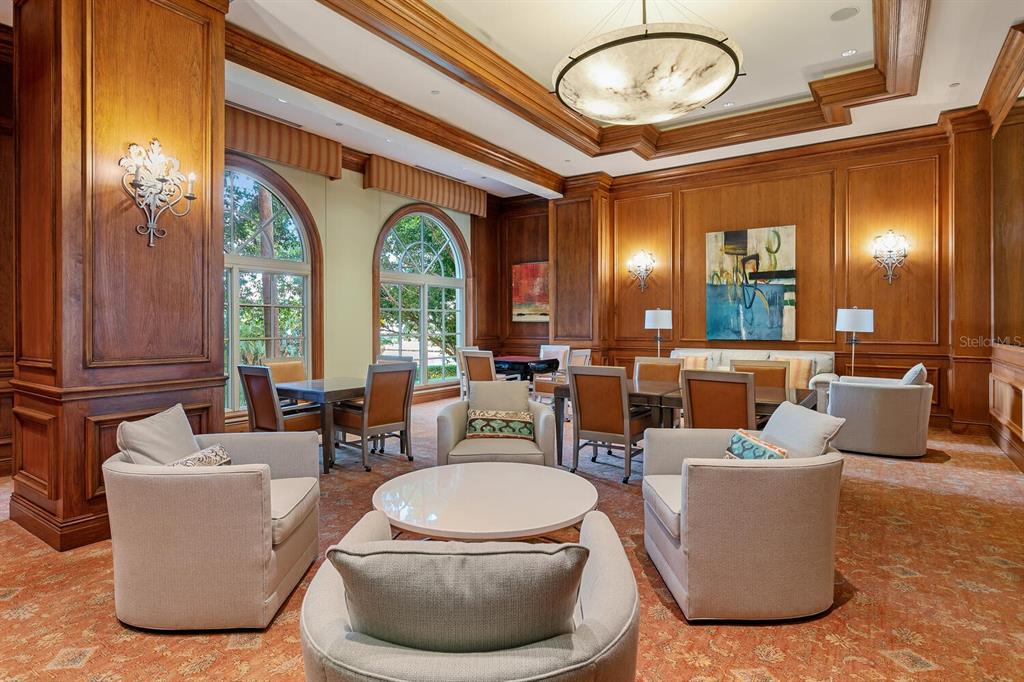 1111 Ritz Carlton Drive, Unit 1803 Sarasota, FL 34236 - Photo 59 of 65 a living room with furniture a large window and potted plants