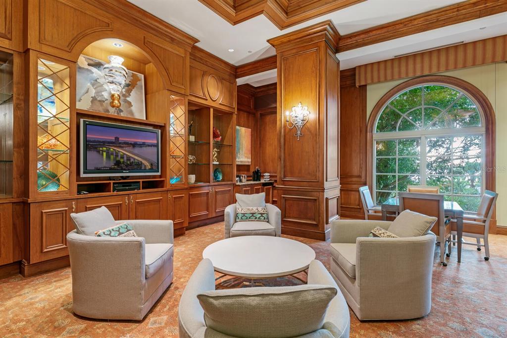 1111 Ritz Carlton Drive, Unit 1803 Sarasota, FL 34236 - Photo 60 of 65 a living room with fireplace furniture and a large window