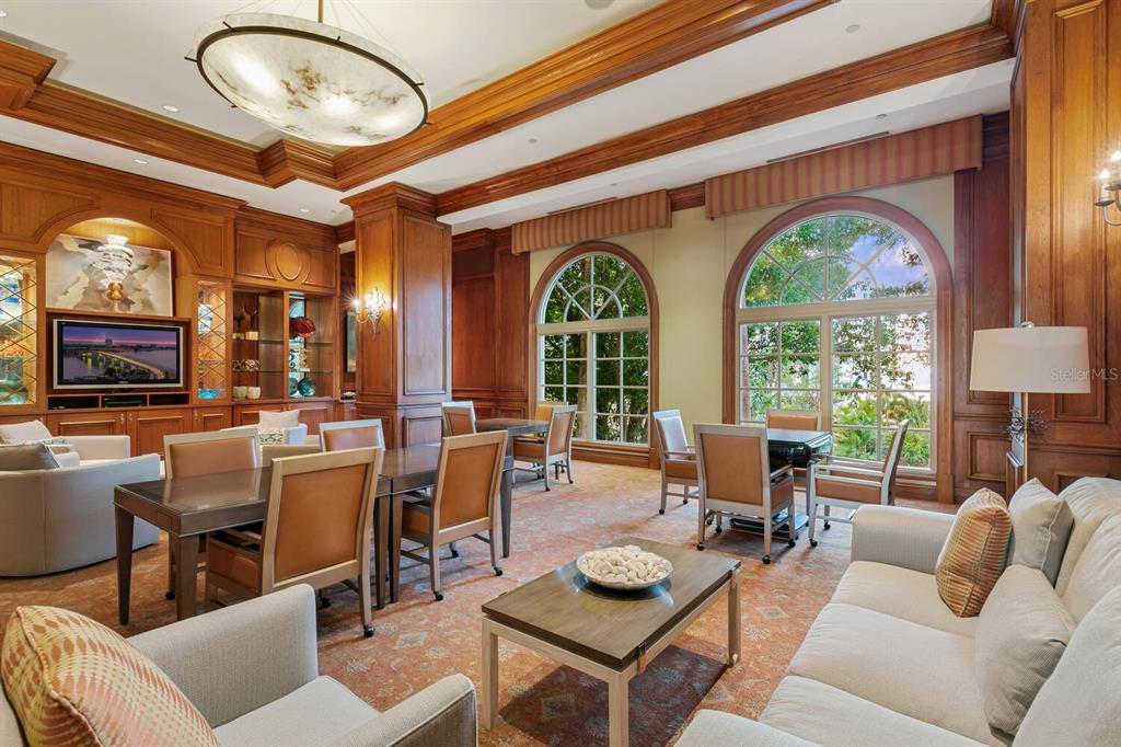 1111 Ritz Carlton Drive, Unit 1803 Sarasota, FL 34236 - Photo 61 of 65 a living room with furniture a large window and flat screen tv