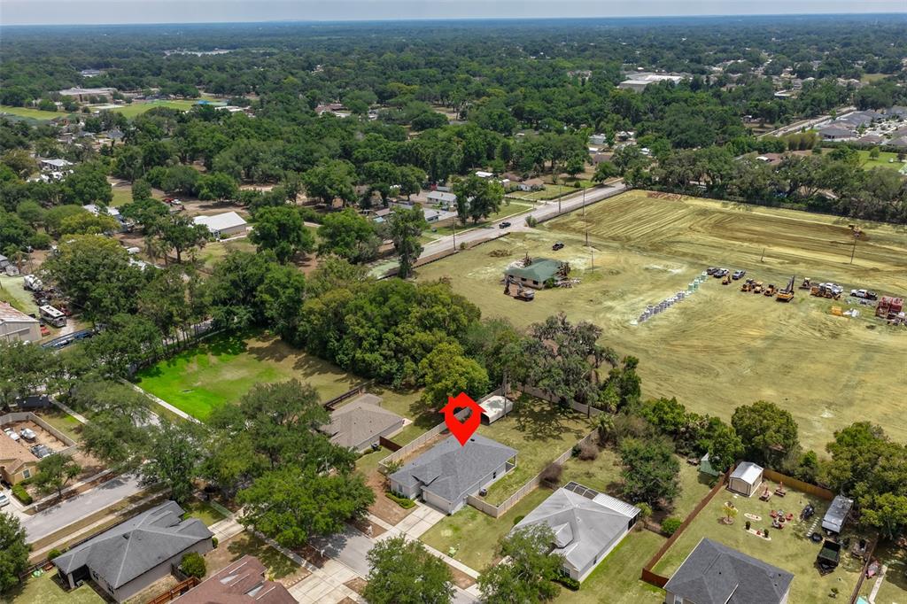 708 Coade Stone Drive Seffner, FL 33584 - Photo 44 of 48 an aerial view of residential houses with outdoor space and trees