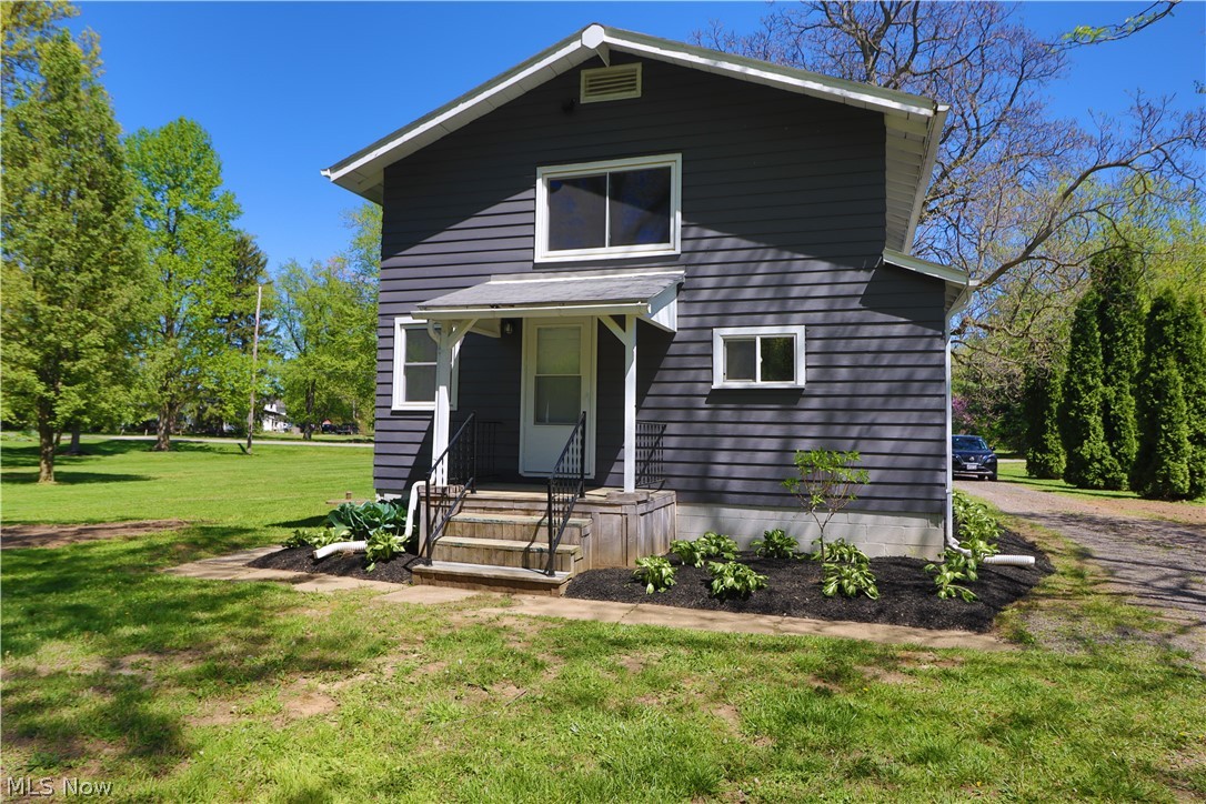 2926 Burns Road Madison, OH 44057 - Photo 35 of 37 View of property with a front lawn
