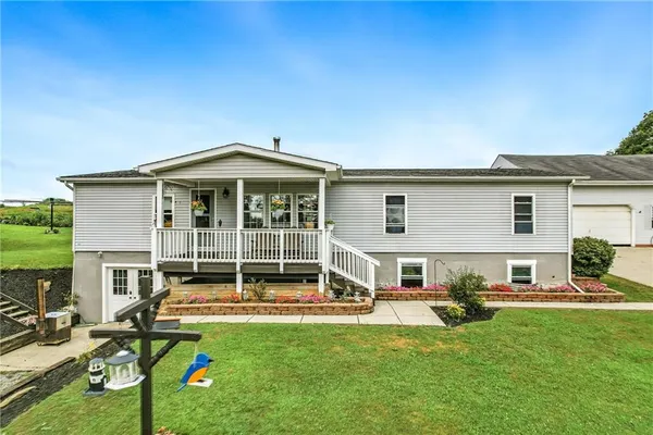front view of a house with a yard
