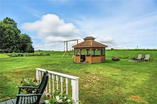 a view of a garden with wooden fence