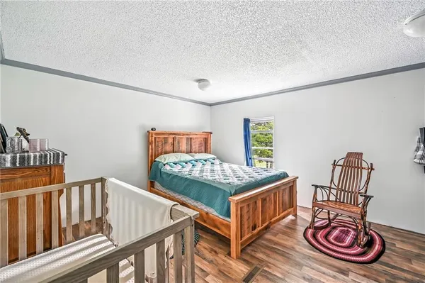 a bedroom with furniture and a window