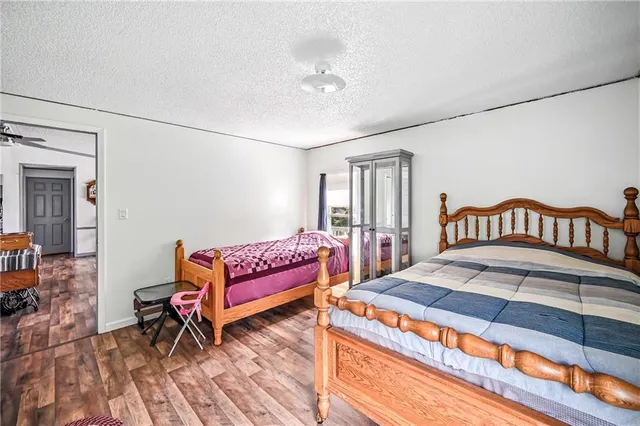 a bedroom with a bed and a dresser