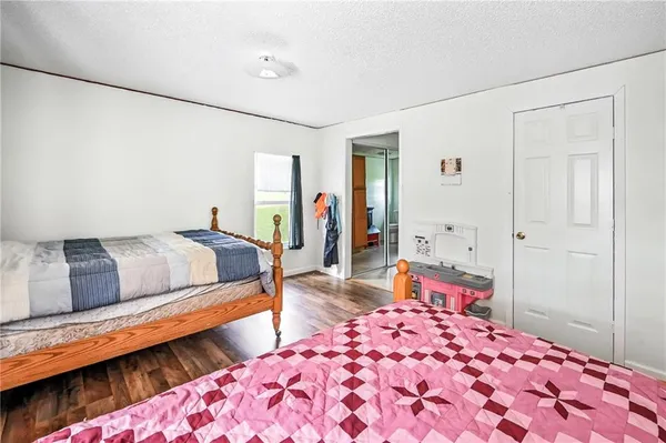 a bedroom with bed and window