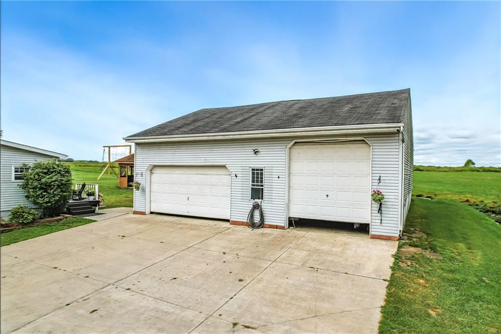 400 Oak Hill Road West Middlesex, PA 16159 - Photo 5 of 41 a view of a house with backyard