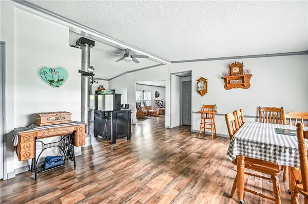 a view of a livingroom with furniture and wooden floor