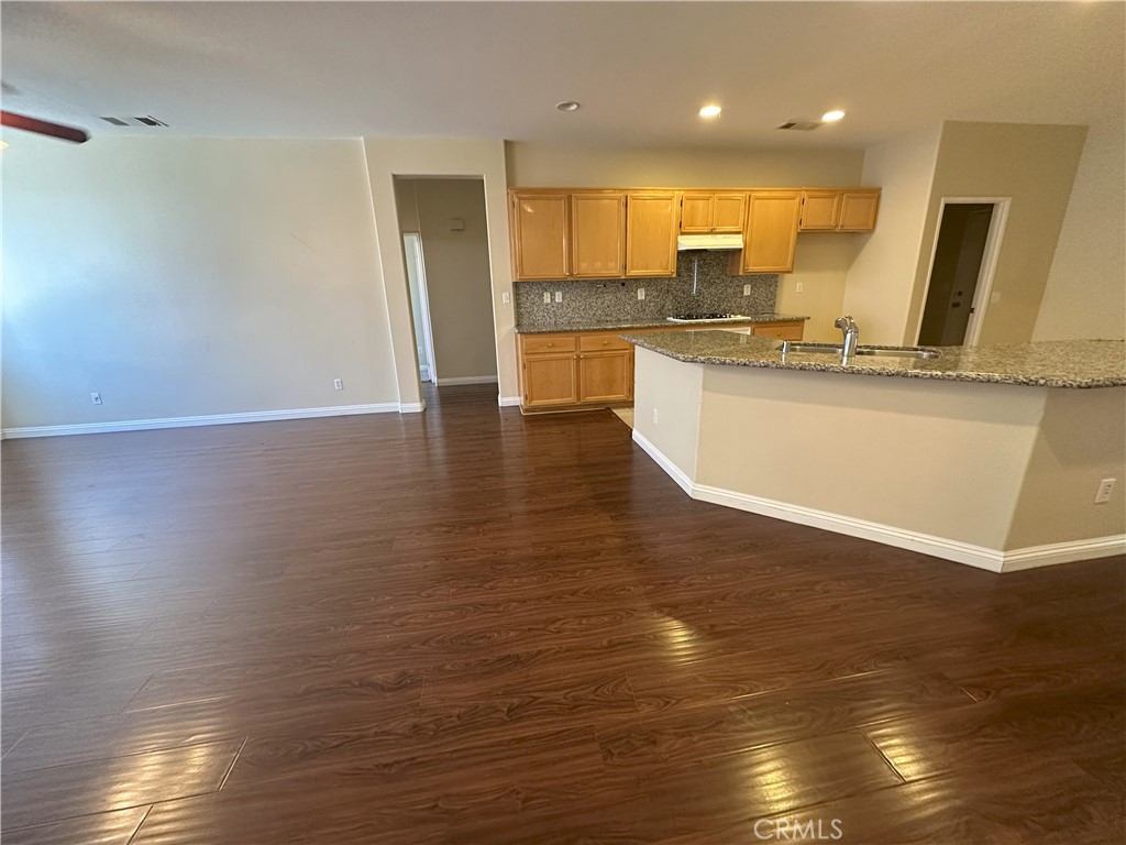 13352 Pleasant View Street Oak Hills, CA 92344 - Photo 6 of 13 a view of kitchen with wooden floor