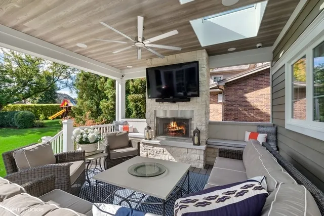 a view of an empty room with a fireplace and a floor to ceiling window
