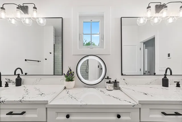 a spacious bathroom with a double vanity sink mirror double and bathtub