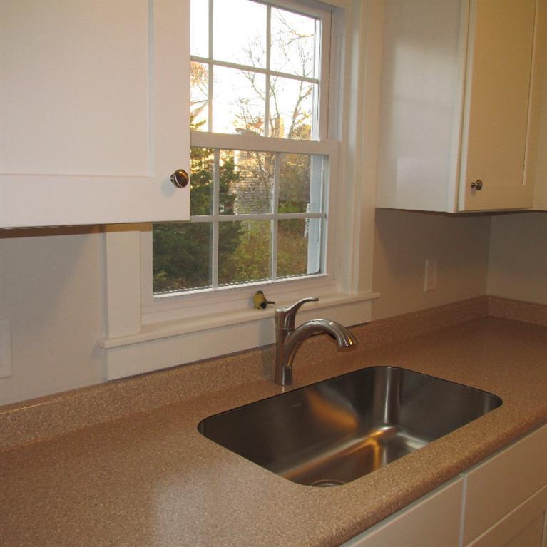 1 Mashnee Road Bourne, MA 02532 - Photo 11 of 29 a kitchen with a sink and large window