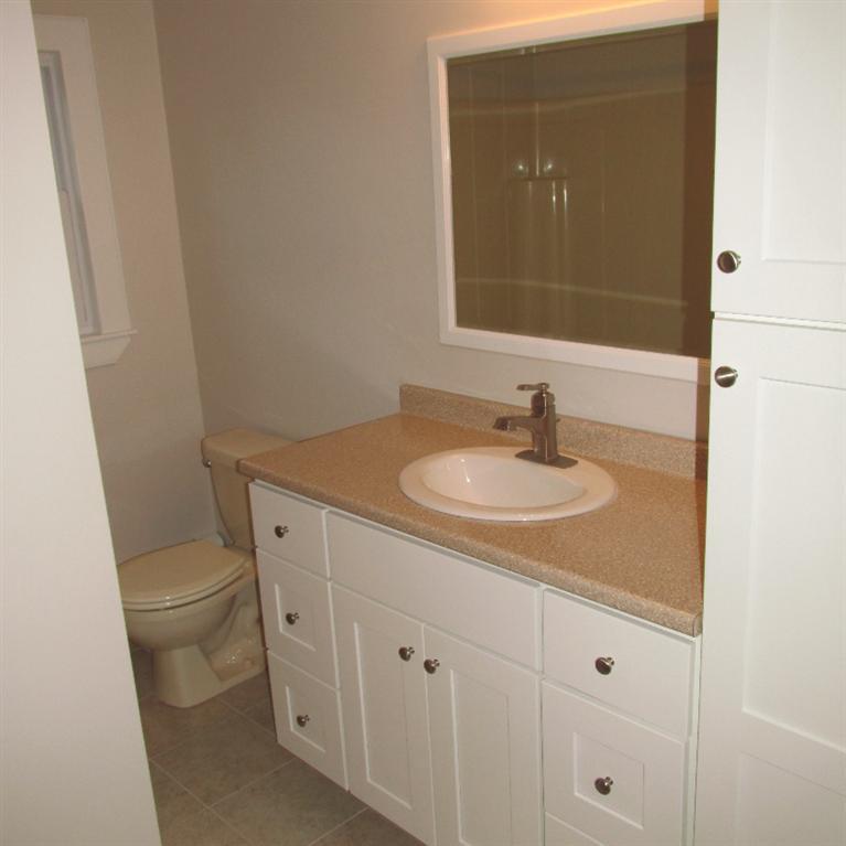 1 Mashnee Road Bourne, MA 02532 - Photo 14 of 29 a bathroom with a sink toilet and vanity