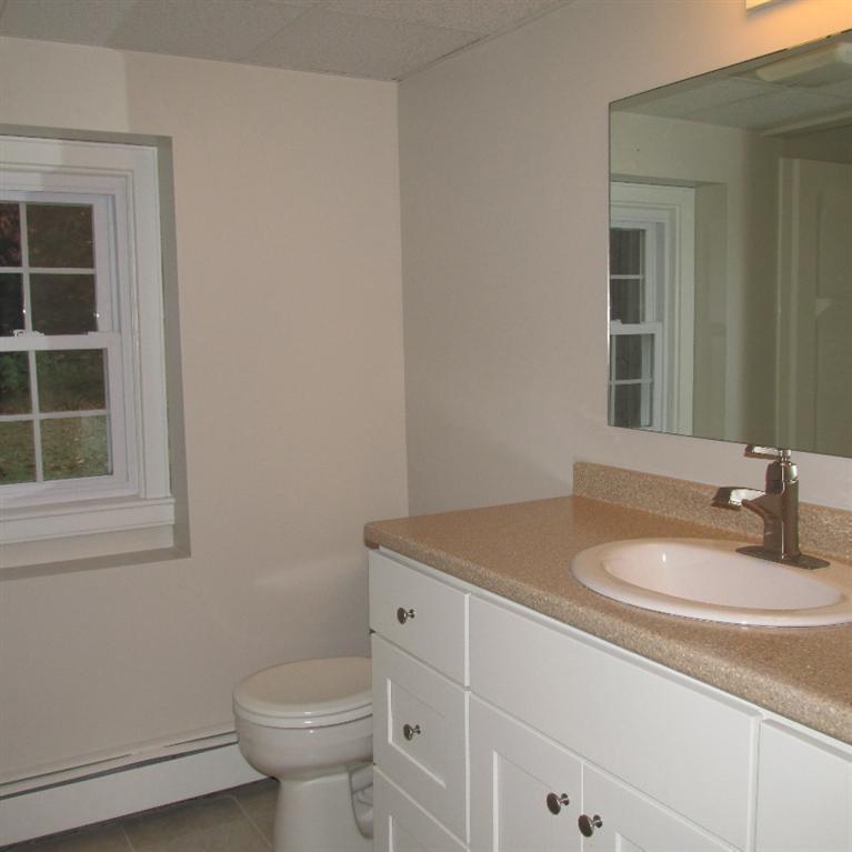 1 Mashnee Road Bourne, MA 02532 - Photo 21 of 29 a bathroom with a sink toilet and a mirror