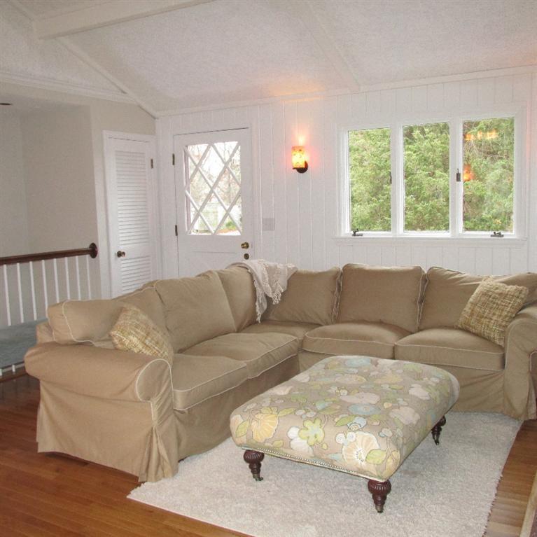 1 Mashnee Road Bourne, MA 02532 - Photo 3 of 29 a living room with furniture and a large window