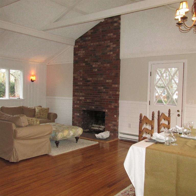 1 Mashnee Road Bourne, MA 02532 - Photo 5 of 29 a living room with furniture and a fireplace