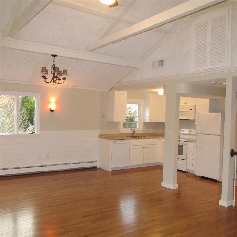 1 Mashnee Road Bourne, MA 02532 - Photo 8 of 29 a kitchen with a refrigerator and countertop