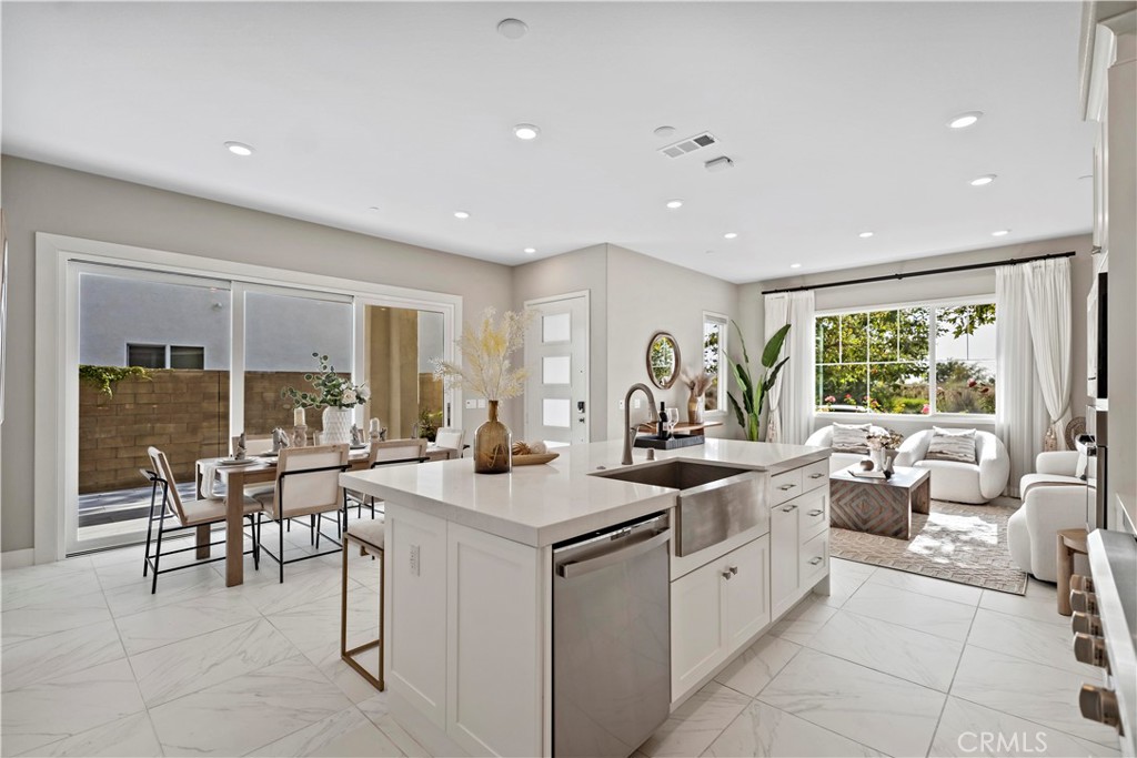 168 Perspective Irvine, CA 92618 - Photo 13 of 62 a kitchen with a sink and chairs