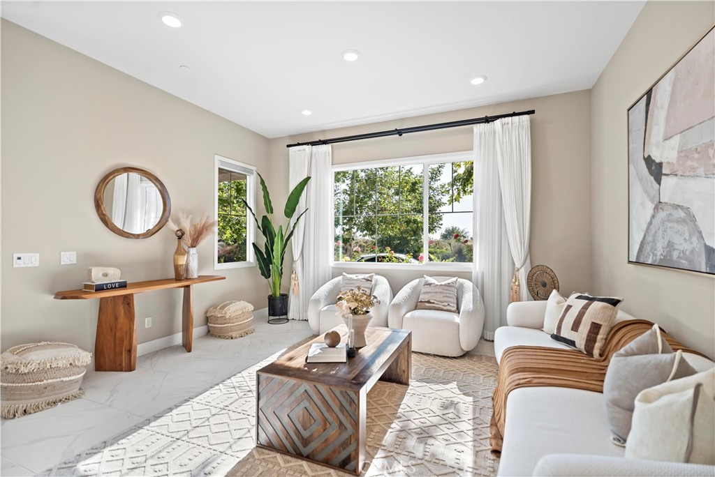 168 Perspective Irvine, CA 92618 - Photo 17 of 62 a living room with furniture and a large window
