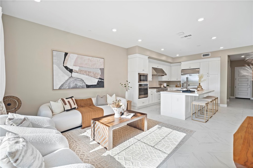 168 Perspective Irvine, CA 92618 - Photo 20 of 62 a living room with furniture and kitchen view