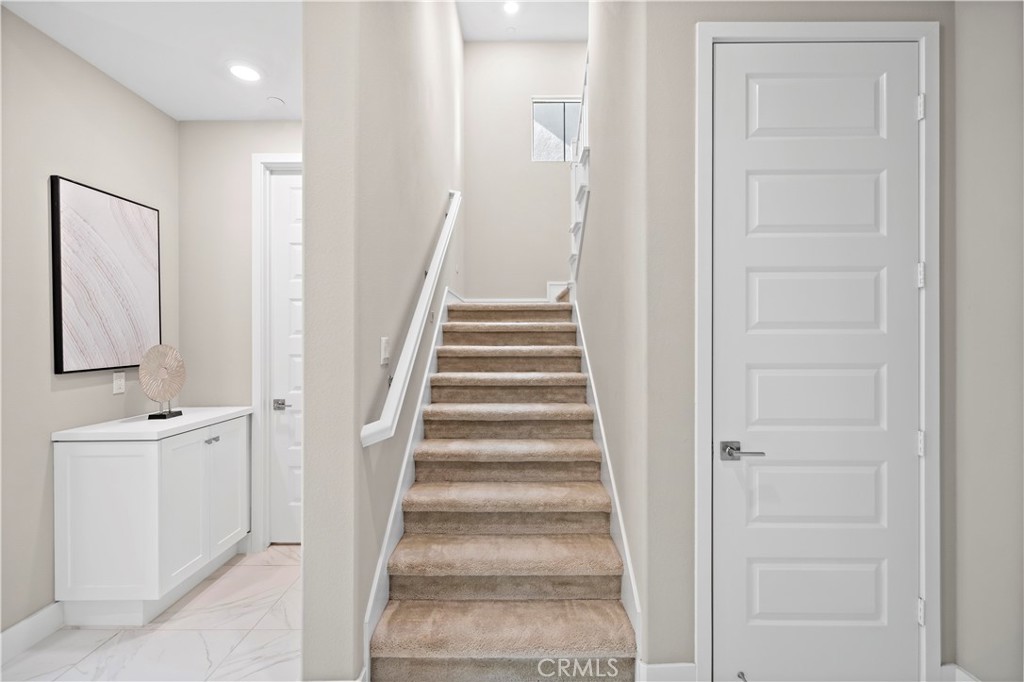 168 Perspective Irvine, CA 92618 - Photo 23 of 62 a view of a hallway with wooden floor and entryway
