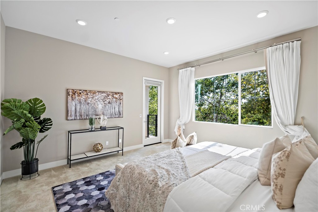 168 Perspective Irvine, CA 92618 - Photo 26 of 62 a bedroom with furniture and a large window