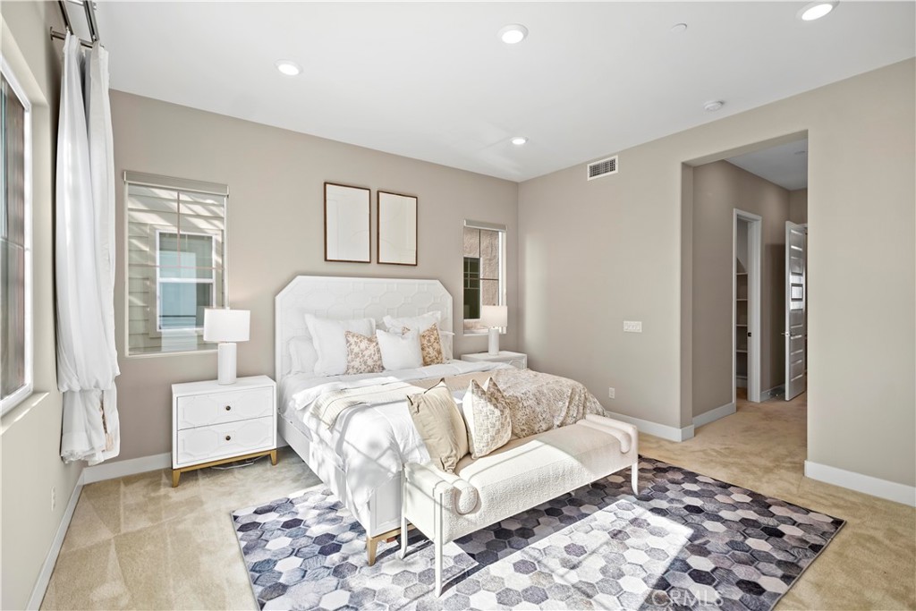 168 Perspective Irvine, CA 92618 - Photo 29 of 62 a bedroom with a bed and a couch