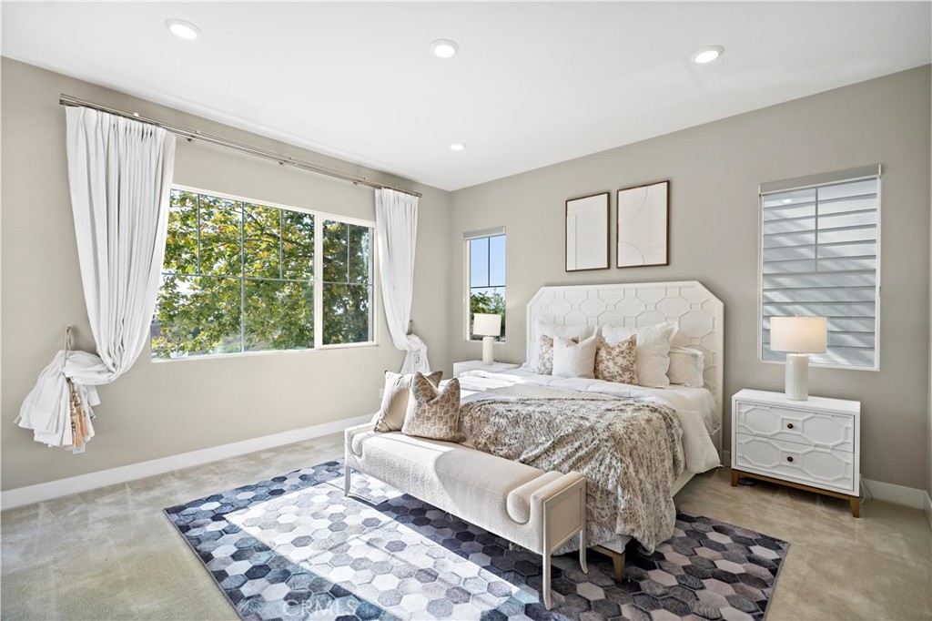 168 Perspective Irvine, CA 92618 - Photo 30 of 62 a bedroom with a large bed and a window