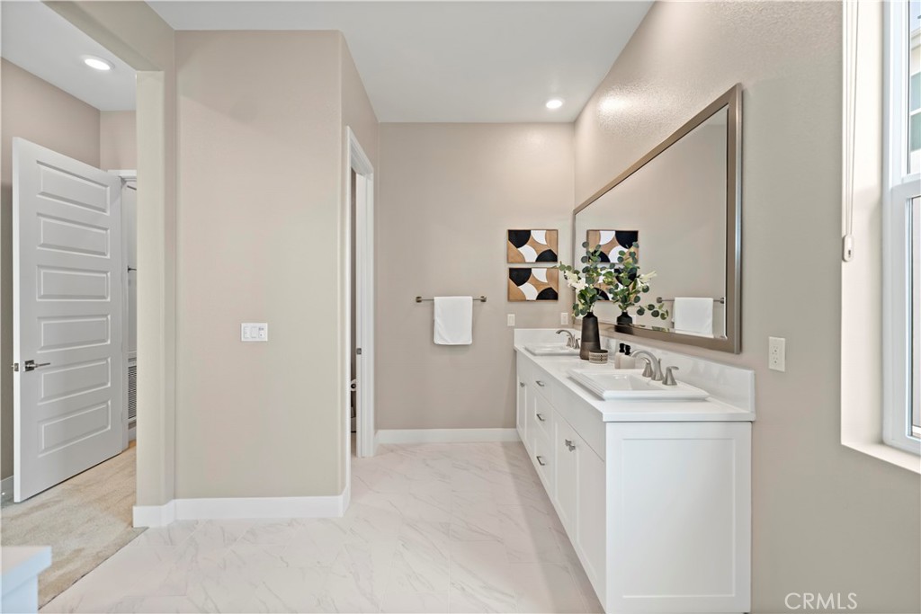 168 Perspective Irvine, CA 92618 - Photo 37 of 62 a bathroom with a double vanity sink mirror and shower