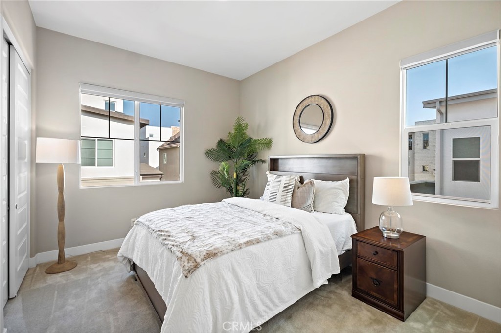 168 Perspective Irvine, CA 92618 - Photo 40 of 62 a bedroom with a bed and a window