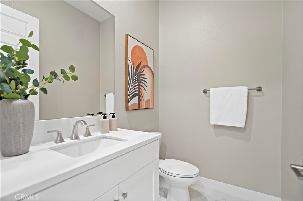 168 Perspective Irvine, CA 92618 - Photo 42 of 62 a bathroom with a sink a toilet and a mirror