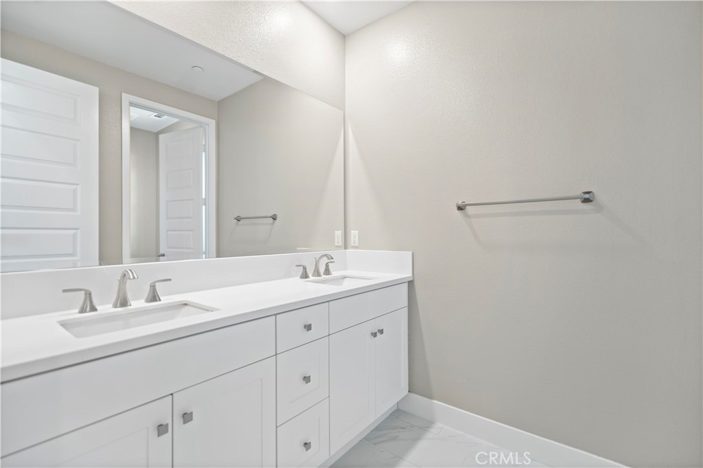 168 Perspective Irvine, CA 92618 - Photo 43 of 62 a bathroom with a sink and a mirror