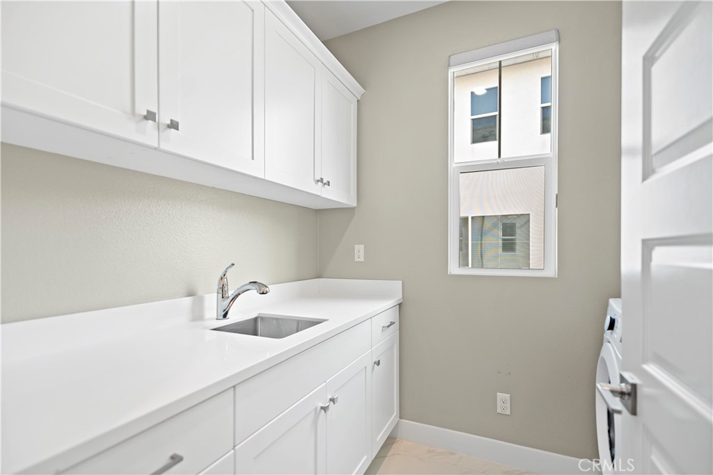 168 Perspective Irvine, CA 92618 - Photo 47 of 62 a kitchen with a sink and cabinets