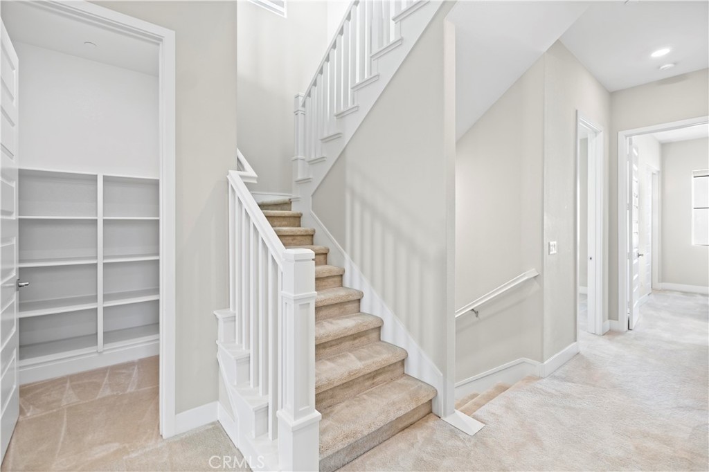 168 Perspective Irvine, CA 92618 - Photo 48 of 62 a view of staircase with white walls and white walls
