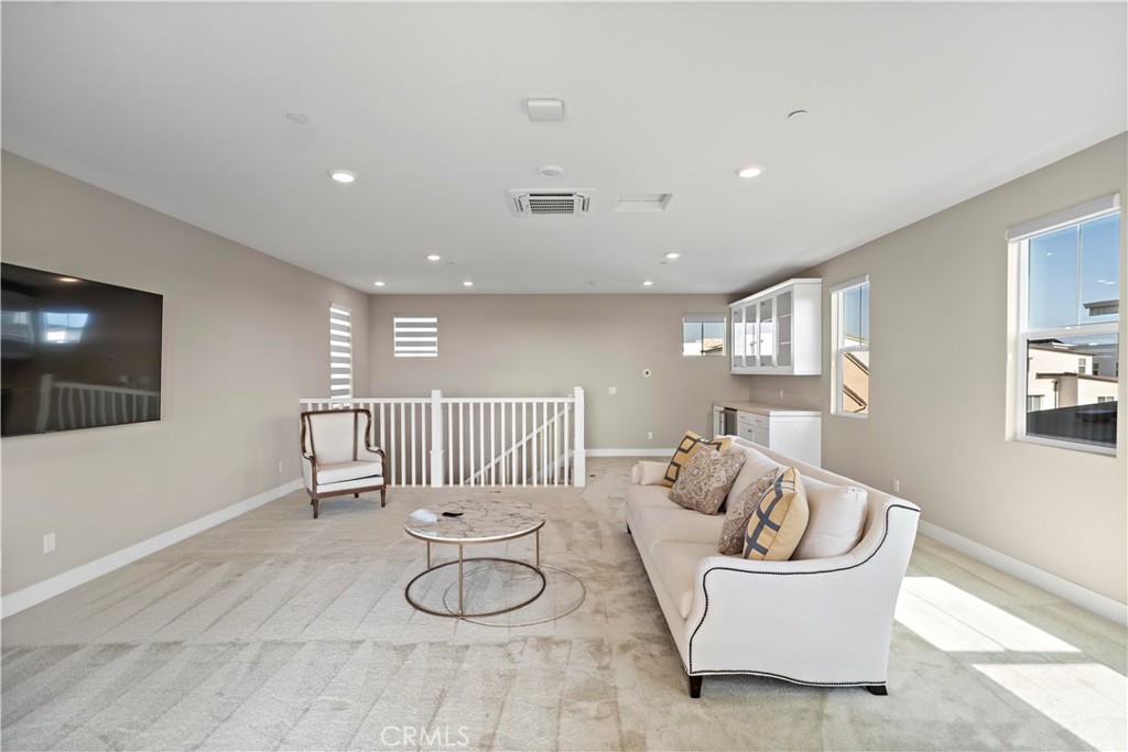 168 Perspective Irvine, CA 92618 - Photo 52 of 62 a living room with furniture and a flat screen tv