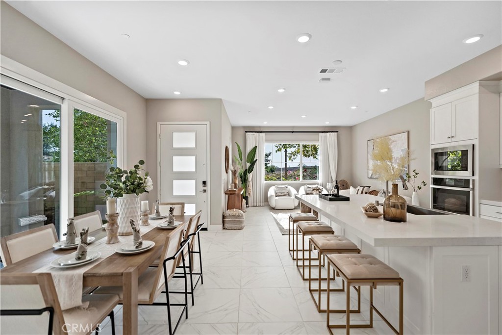 168 Perspective Irvine, CA 92618 - Photo 6 of 62 a view of a dining room with furniture window and outside view