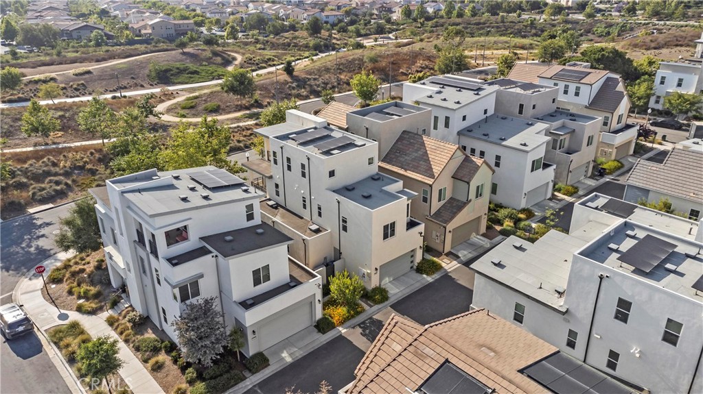 168 Perspective Irvine, CA 92618 - Photo 62 of 62 an aerial view of a residential apartment building with parking