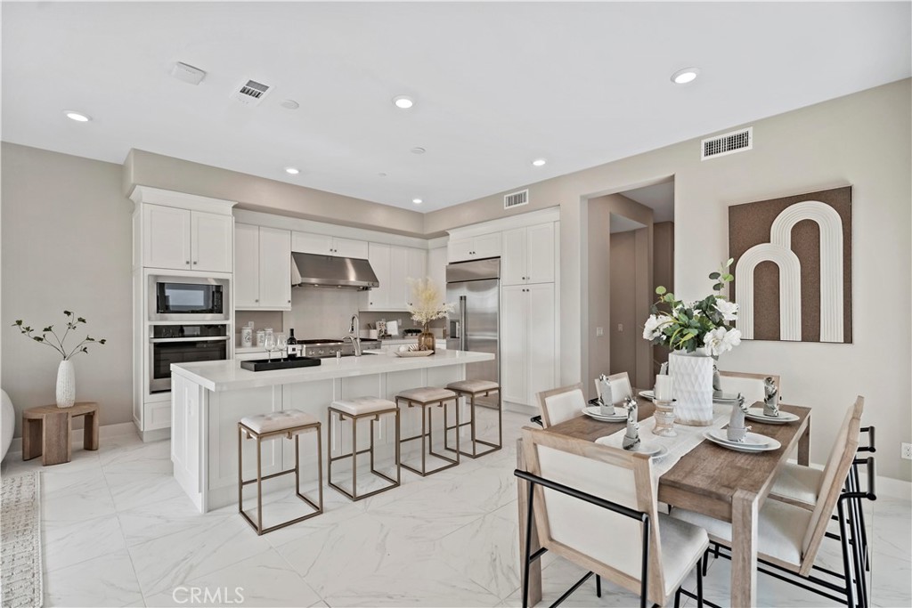 168 Perspective Irvine, CA 92618 - Photo 9 of 62 a view of a dining room with furniture