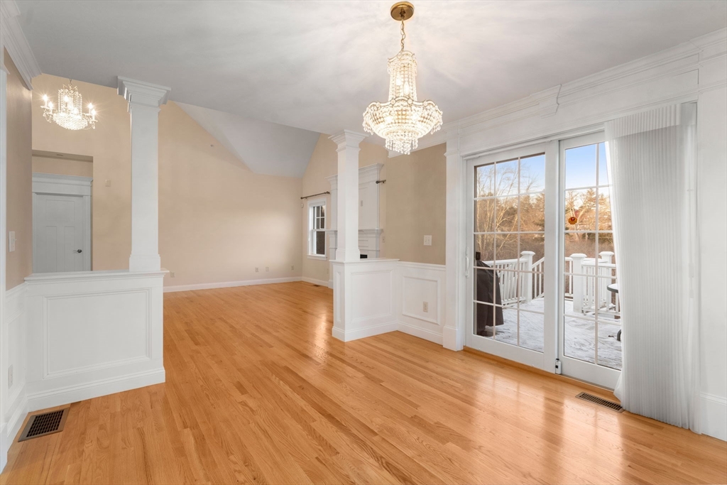 9 River Rock Way, Unit 9 Wayland, MA 01778 - Photo 11 of 39 a view of livingroom with chandelier