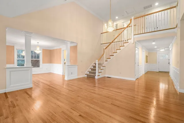 a view of an entryway with wooden floor