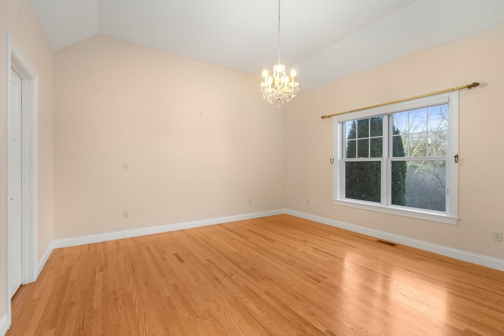 9 River Rock Way, Unit 9 Wayland, MA 01778 - Photo 17 of 39 a view of empty room with wooden floor and fan