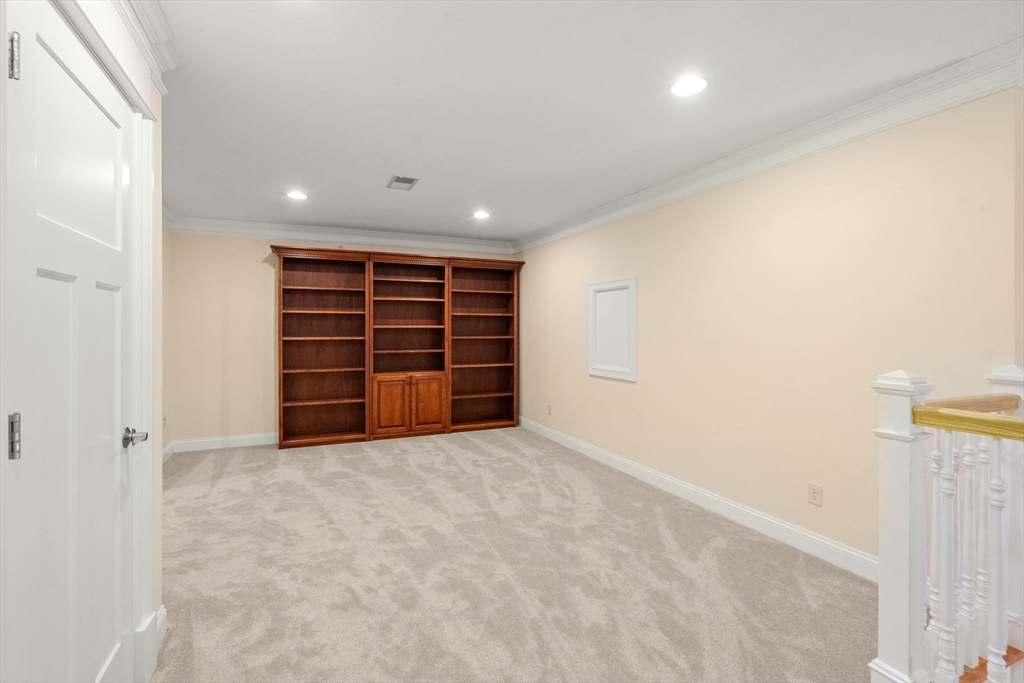 9 River Rock Way, Unit 9 Wayland, MA 01778 - Photo 22 of 39 a view of an empty room with a hallway