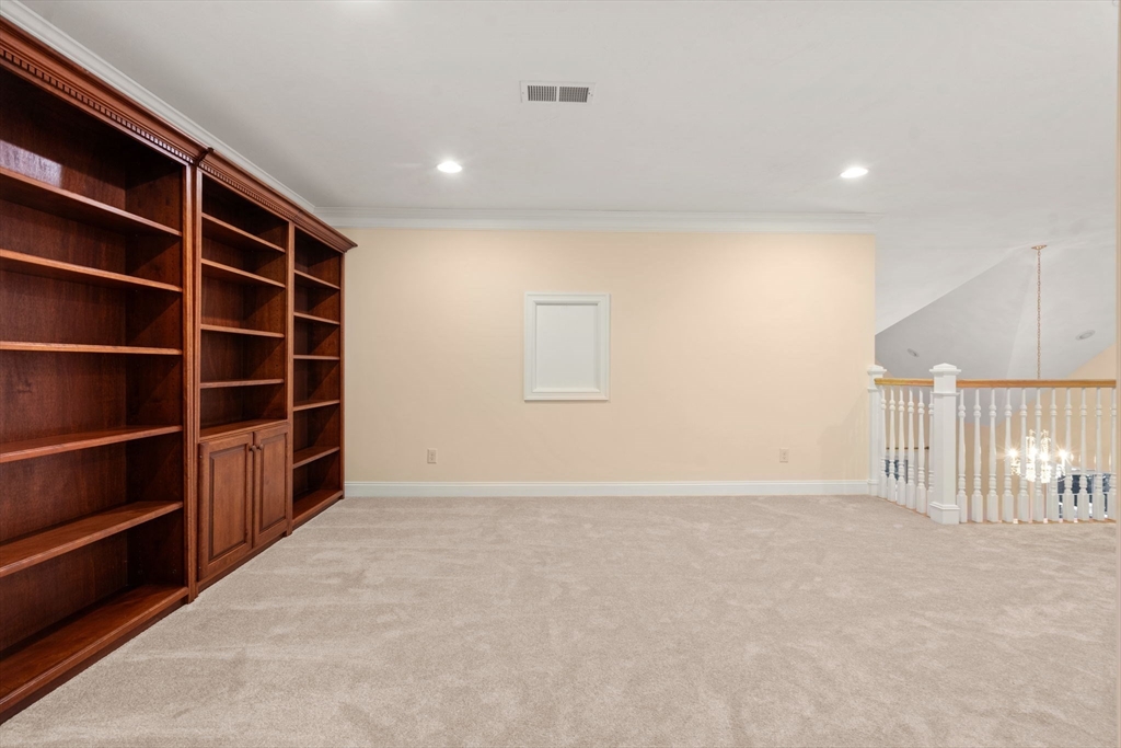 9 River Rock Way, Unit 9 Wayland, MA 01778 - Photo 23 of 39 a view of an empty room with a window