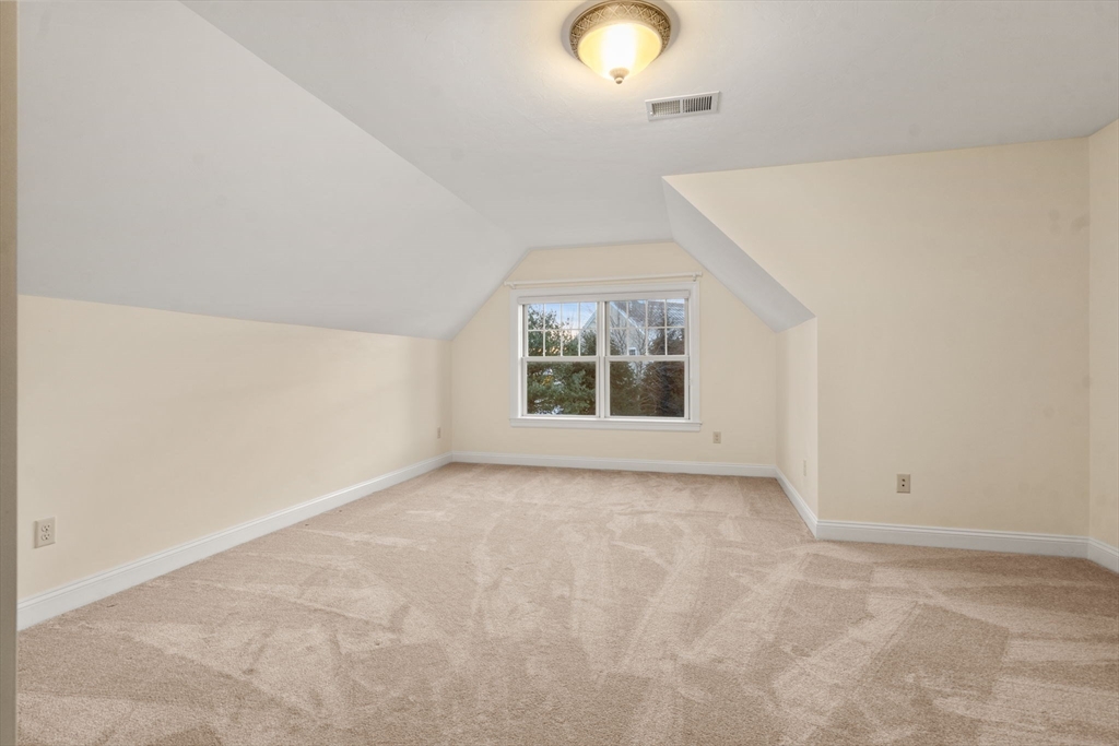 9 River Rock Way, Unit 9 Wayland, MA 01778 - Photo 26 of 39 an empty room with windows
