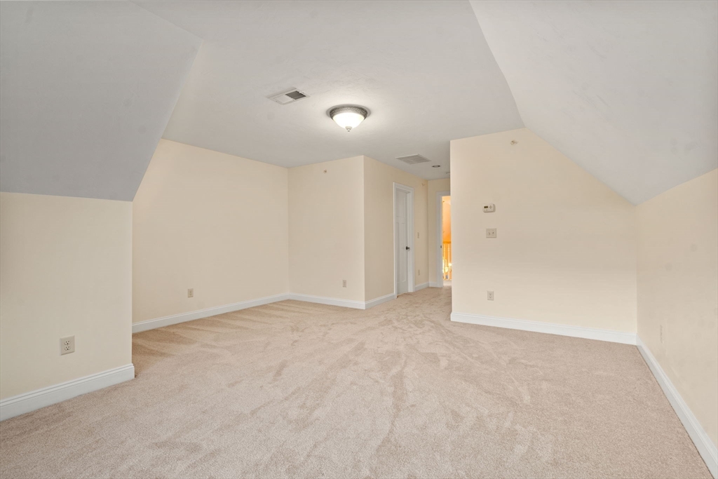 9 River Rock Way, Unit 9 Wayland, MA 01778 - Photo 27 of 39 a view of an empty room